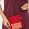 women meditation maroon sling bag