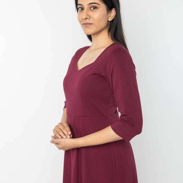 Woman standing gracefully in the cotton lycra Samiksha Meditation Robe for daily practice.