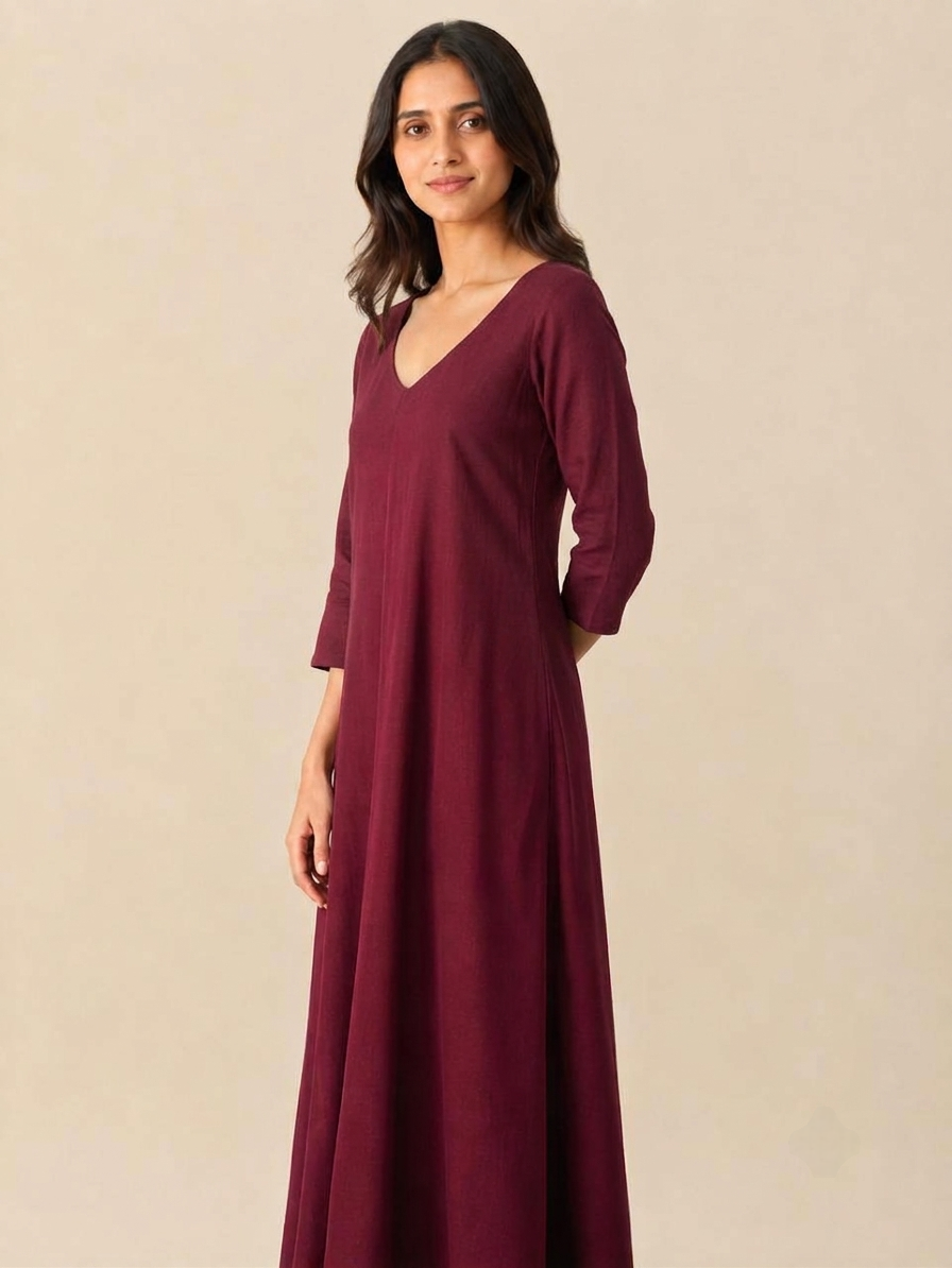 Side profile of the flowing Dhyana women's 3/4th sleeve rayon meditation robe in maroon