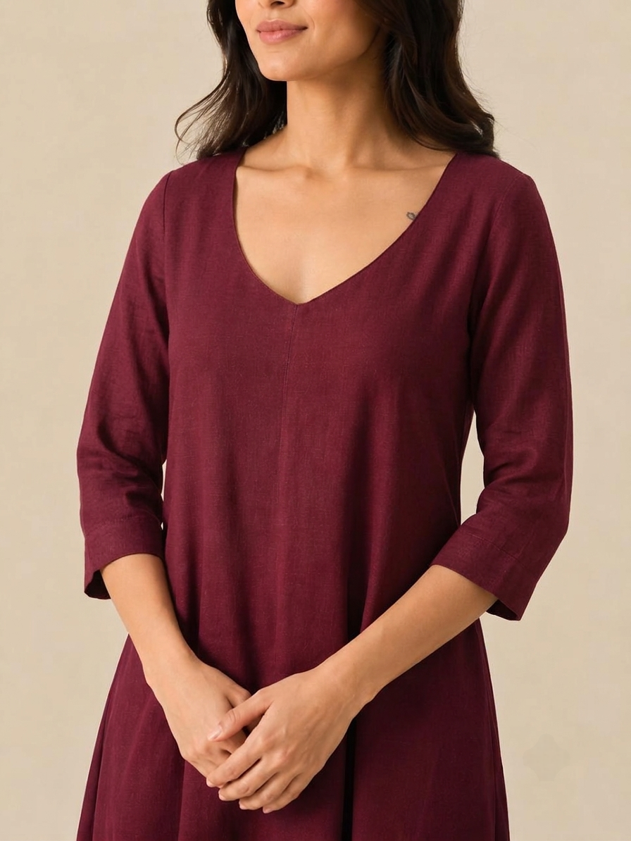 Close-up V-neck detail and 3/4th sleeves on the Dhyana maroon rayon meditation dress