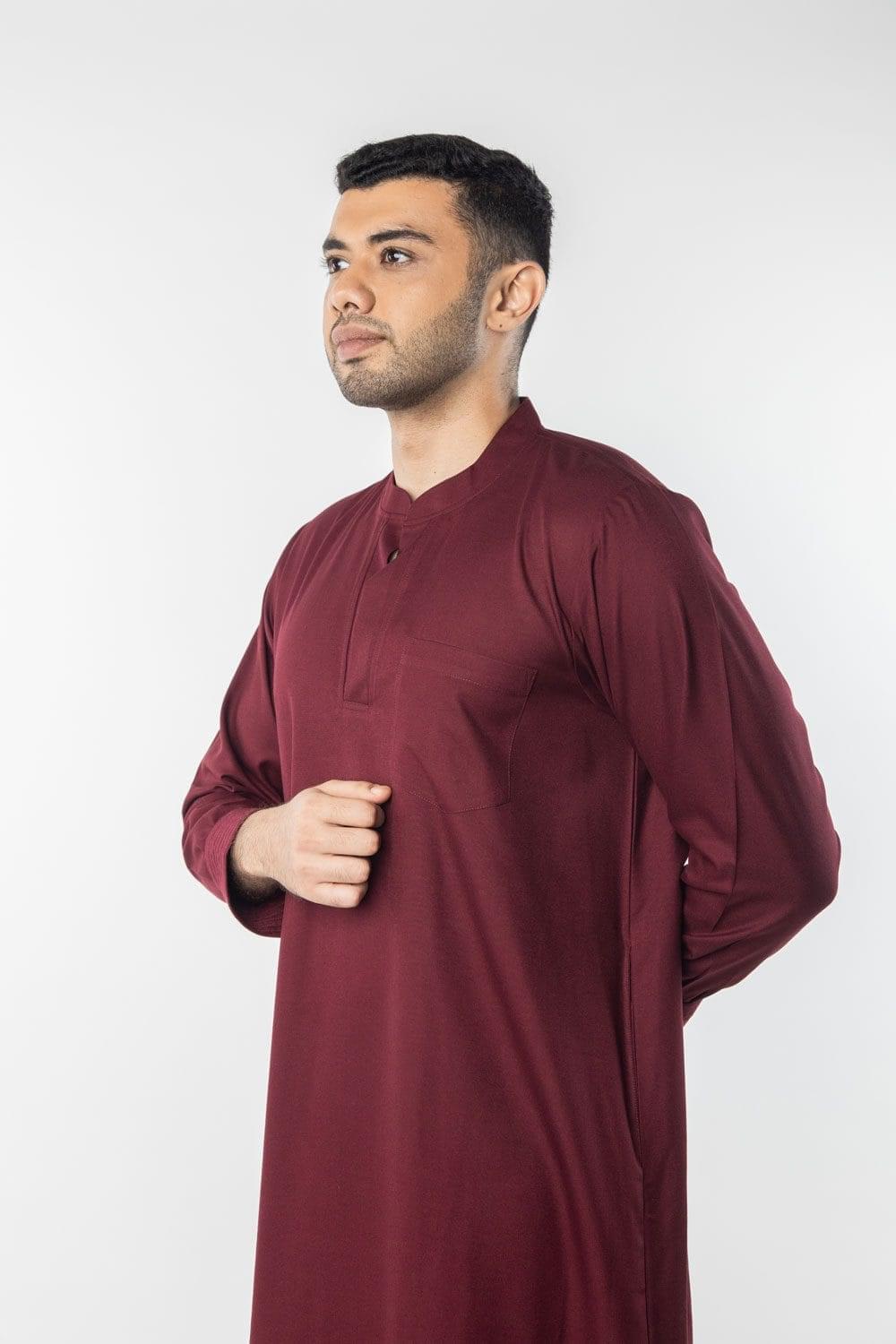 Side view showing the loose, relaxed fit of the maroon robe osho during practice.