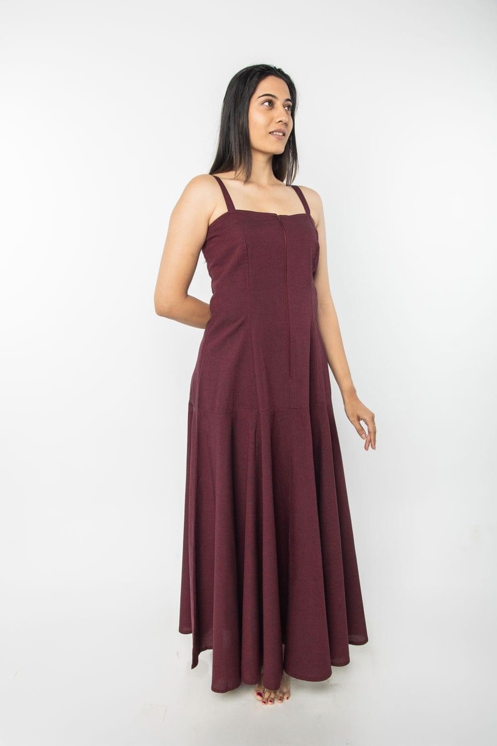 Woman wearing maroon Osho Sufi meditation robe with strappy neckline